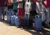 Gas distributed amidst police protection as shortage takes its toll