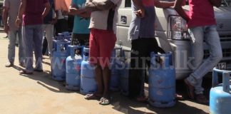 Gas distributed amidst police protection as shortage takes its toll