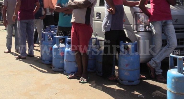 Gas distributed amidst police protection as shortage takes its toll